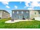 Enjoy the spacious backyard featuring a concrete patio, fire pit, and outdoor seating at 670 Belle Grove Dr, Clover, SC 29710