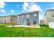 Large backyard featuring a patio with a fire pit and outdoor seating at 670 Belle Grove Dr, Clover, SC 29710