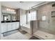 Modern bathroom with a tub, shower, double vanity, and neutral color palette at 670 Belle Grove Dr, Clover, SC 29710