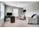 Bright bedroom with two windows, a desk, and two sitting chairs at 670 Belle Grove Dr, Clover, SC 29710
