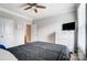 Bright bedroom featuring a ceiling fan and white dresser with television at 670 Belle Grove Dr, Clover, SC 29710