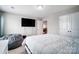Comfortable bedroom with a large television, beanbag chair, and closet at 670 Belle Grove Dr, Clover, SC 29710