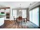 Dining room with sliding glass doors, windows, and adjacent to the kitchen area at 670 Belle Grove Dr, Clover, SC 29710