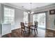 Dining area with bright windows, a sliding glass door, and a wooden table at 670 Belle Grove Dr, Clover, SC 29710