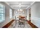 Dining room with modern lighting, a round table, and wainscoting at 670 Belle Grove Dr, Clover, SC 29710