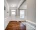 Elegant foyer featuring hardwood floors, wainscoting, and a bright entrance at 670 Belle Grove Dr, Clover, SC 29710