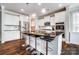 Modern kitchen with white cabinets, a center island with seating, and stainless steel appliances at 670 Belle Grove Dr, Clover, SC 29710
