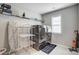 Modern laundry room with front load washer and dryer, and metal shelving at 670 Belle Grove Dr, Clover, SC 29710