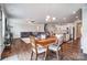Open floorplan with wood floors, dining table, and a kitchen island at 670 Belle Grove Dr, Clover, SC 29710