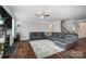 Large living room with hardwood floors, a fireplace, and a comfortable sectional sofa at 670 Belle Grove Dr, Clover, SC 29710