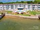 Stunning aerial view showcasing the community's waterfront location, pool, and lush landscaping at 7831 Spinnaker Bay Dr # 106, Sherrills Ford, NC 28673