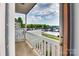 View from the balcony showing a beautiful lakeside landscape with a marina and greenery on a partly cloudy day at 7831 Spinnaker Bay Dr # 106, Sherrills Ford, NC 28673