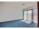 Inviting bedroom with light filtering through vertical blinds with a lovely lake view from the sliding glass door at 7831 Spinnaker Bay Dr # 106, Sherrills Ford, NC 28673
