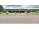 Exterior of condos featuring a parking lot and green space at 7831 Spinnaker Bay Dr # 106, Sherrills Ford, NC 28673