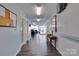 Bright hallway featuring sleek floors, a convenient console table, and ample built-in storage at 7831 Spinnaker Bay Dr # 106, Sherrills Ford, NC 28673