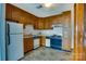 Functional kitchen featuring wooden cabinets, an efficient layout, and classic appliances, offering practicality at 7831 Spinnaker Bay Dr # 106, Sherrills Ford, NC 28673