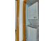 A stacked white washer and dryer set neatly tucked inside a laundry closet with wood trim at 7831 Spinnaker Bay Dr # 106, Sherrills Ford, NC 28673
