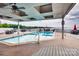 Community pool with seating under a covered structure, situated near a lake for enjoyable relaxation at 7831 Spinnaker Bay Dr # 106, Sherrills Ford, NC 28673