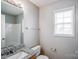 Cozy bathroom with granite countertop vanity and natural light at 8545 Filbert Ln, Charlotte, NC 28215