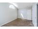 Cozy bedroom featuring window arch and carpet at 8545 Filbert Ln, Charlotte, NC 28215