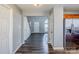 Foyer showcasing stairs, modern flooring, and an entry view into the kitchen at 8545 Filbert Ln, Charlotte, NC 28215