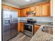 Kitchen features stainless steel appliances, including a refrigerator and oven at 8545 Filbert Ln, Charlotte, NC 28215