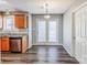Bright kitchen area with stainless steel appliances, granite countertops, and wood-look flooring at 8545 Filbert Ln, Charlotte, NC 28215