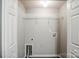 Well-lit laundry room with washer hookups and storage at 8545 Filbert Ln, Charlotte, NC 28215