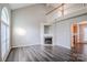Bright living room with vaulted ceiling, fireplace, and large arched window at 8545 Filbert Ln, Charlotte, NC 28215