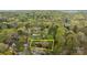 An aerial view showcasing the beautiful home nestled among the trees, surrounded by lush greenery at 9004 Cebu Ct, Fort Mill, SC 29708