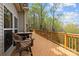 Spacious back deck with wooden furniture that's perfect for entertaining guests or relaxing outdoors at 9004 Cebu Ct, Fort Mill, SC 29708
