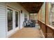 Outdoor patio area that features a cozy seating and dining space with a grill and outdoor lighting at 9004 Cebu Ct, Fort Mill, SC 29708