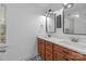 Well-lit bathroom features a double vanity with modern fixtures and a decorative tile floor at 9004 Cebu Ct, Fort Mill, SC 29708