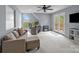 Bright bonus room with a comfortable seating area, a workstation, and access to outdoor views at 9004 Cebu Ct, Fort Mill, SC 29708