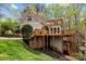 Charming two-story home with multi-level wooden decks, beautiful landscaping, and a well-maintained lawn at 9004 Cebu Ct, Fort Mill, SC 29708
