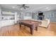 Large game room with a pool table, kitchenette, and comfortable seating area with fireplace at 9004 Cebu Ct, Fort Mill, SC 29708