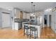 Bright kitchen with stainless steel appliances, black granite countertops, and a central island at 9004 Cebu Ct, Fort Mill, SC 29708
