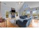 Bright, open living room featuring vaulted ceiling, a stone fireplace, hardwood floors, and lots of natural light at 9004 Cebu Ct, Fort Mill, SC 29708
