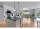 Open-concept living space with hardwood floors, a fireplace, and a dining area at 9004 Cebu Ct, Fort Mill, SC 29708