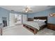Spacious primary bedroom featuring soft blue walls, neutral carpeting, and ample natural light at 9004 Cebu Ct, Fort Mill, SC 29708
