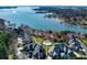 Stunning aerial view of lakeside homes with a community pool, manicured lawns, and access to the water at 101 N Cove Key Ln, Mooresville, NC 28117