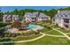An aerial photograph showing a communal swimming pool, walkway and condominium style homes at 101 N Cove Key Ln, Mooresville, NC 28117