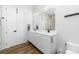 Contemporary bathroom with a double sink vanity, modern fixtures, and a neutral color palette at 101 N Cove Key Ln, Mooresville, NC 28117