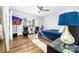 Bright and airy bedroom with a ceiling fan, natural light, and a serene view, creating a relaxing retreat at 101 N Cove Key Ln, Mooresville, NC 28117