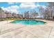 Inviting community pool surrounded by well-maintained landscaping and residential buildings at 101 N Cove Key Ln, Mooresville, NC 28117
