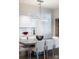 Stunning dining room features a unique lighting fixture and a modern table with seating for six at 101 N Cove Key Ln, Mooresville, NC 28117