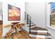 Stylish entryway with modern staircase and decorative table and artwork at 101 N Cove Key Ln, Mooresville, NC 28117