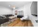 Inviting living room with a comfortable seating area and entertainment center at 101 N Cove Key Ln, Mooresville, NC 28117