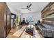 Versatile living space with unique wood accents, comfortable furniture, and natural light at 101 N Cove Key Ln, Mooresville, NC 28117