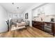 Cozy living room with stylish decor, hardwood floors, and a built-in bar area at 101 N Cove Key Ln, Mooresville, NC 28117